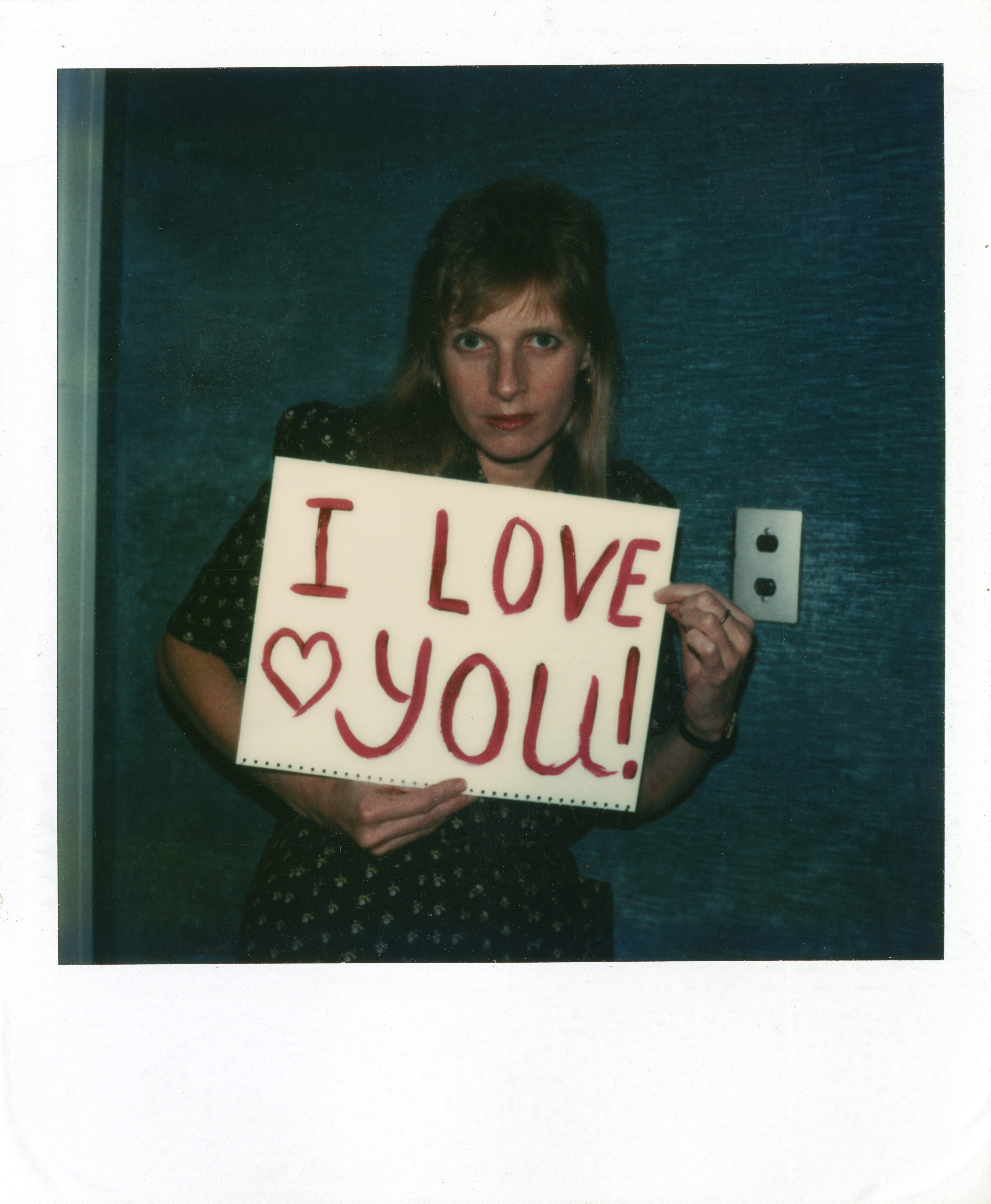 Linda McCartney with 'I Love You' sign